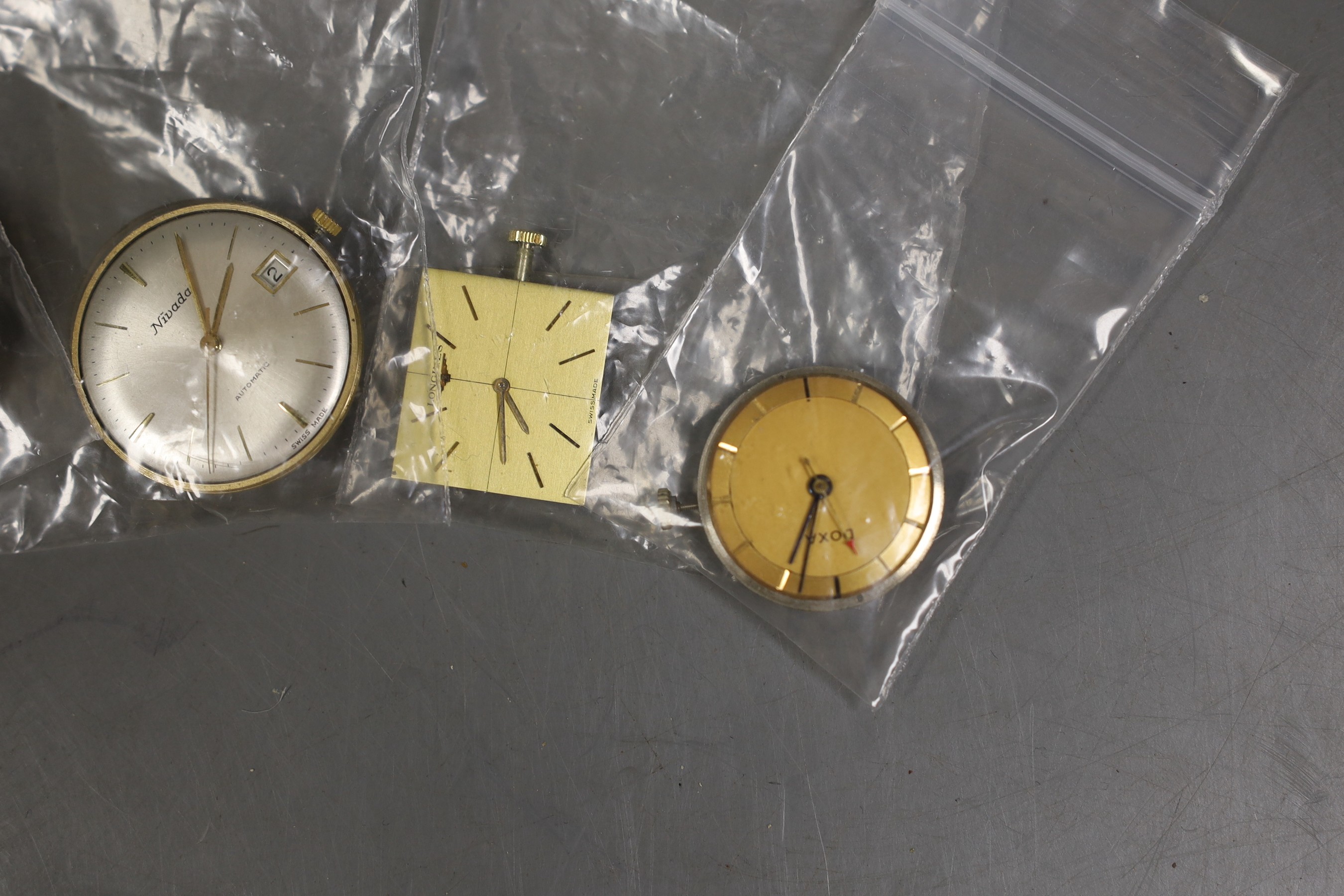 Six assorted wrist watch movements including Longines, Langton, Nivada, Tissot, Doxa and lady's oval dial.